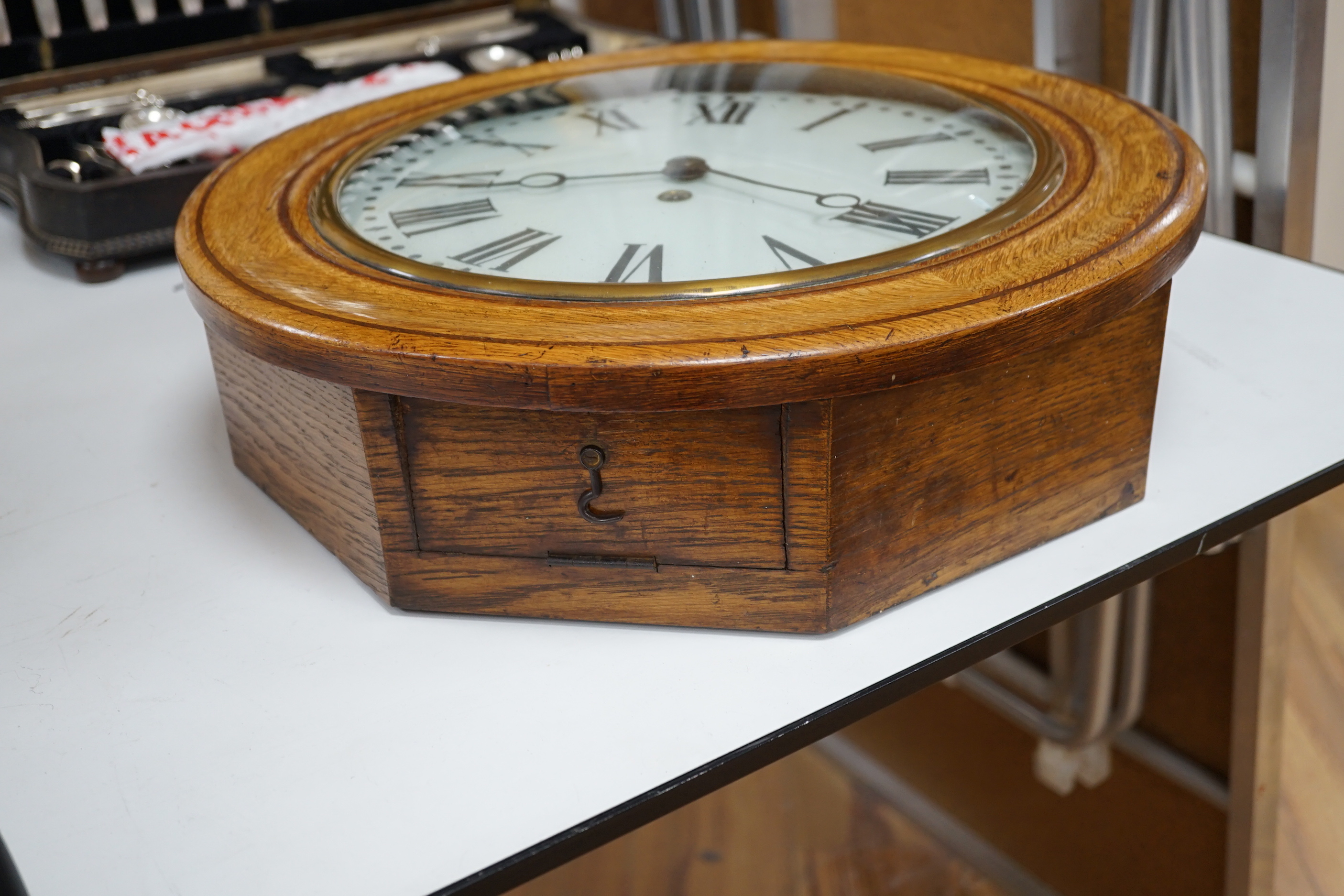 An early 20th century oak wall dial, 46cm diameter